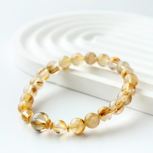 Golden Radiance | 8 mm Rutilated Quartz Bracelet - Gold rutilated quartz, citrine, gold-finished silver bracelet product photograph